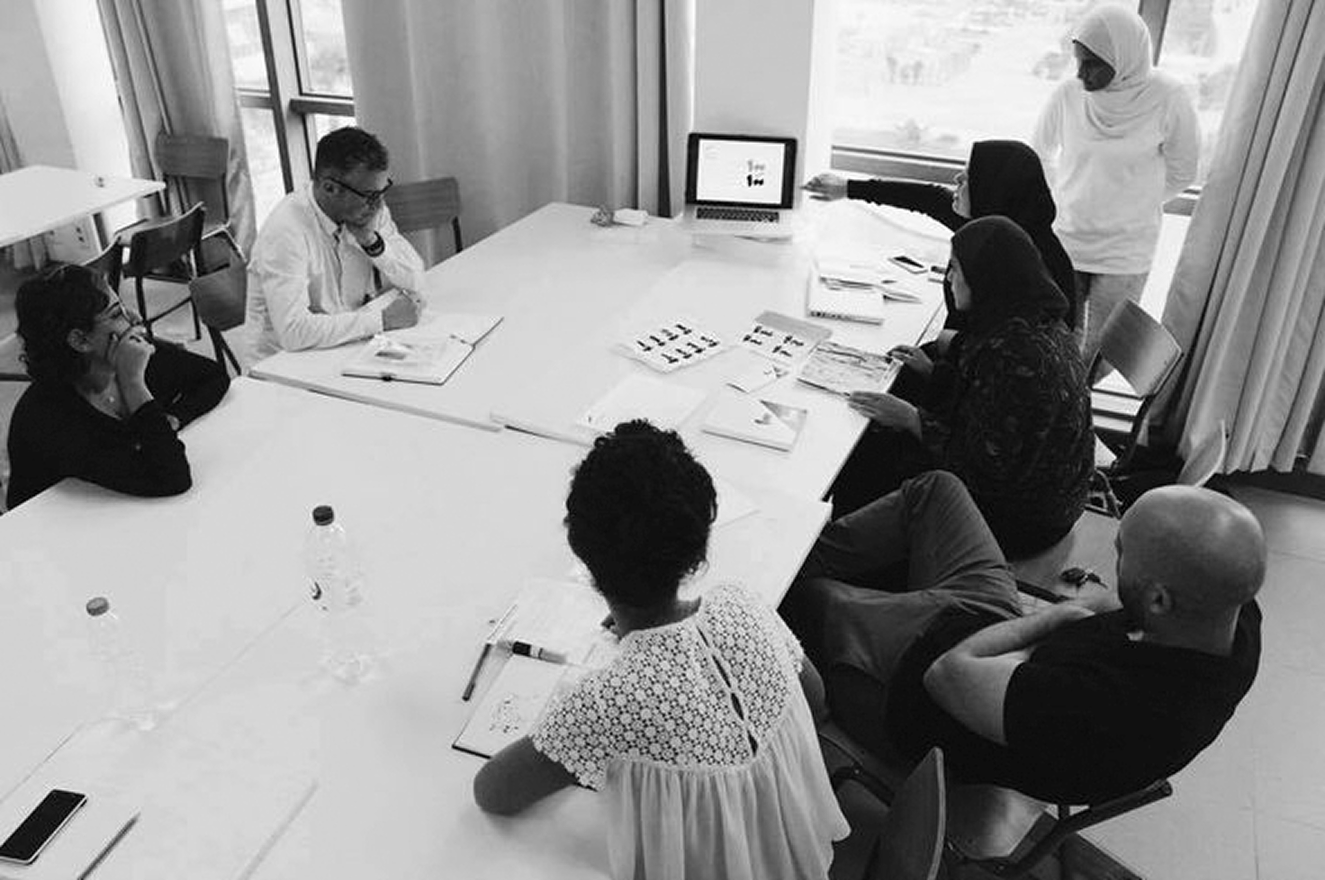 designer reviewing poster layout at desk